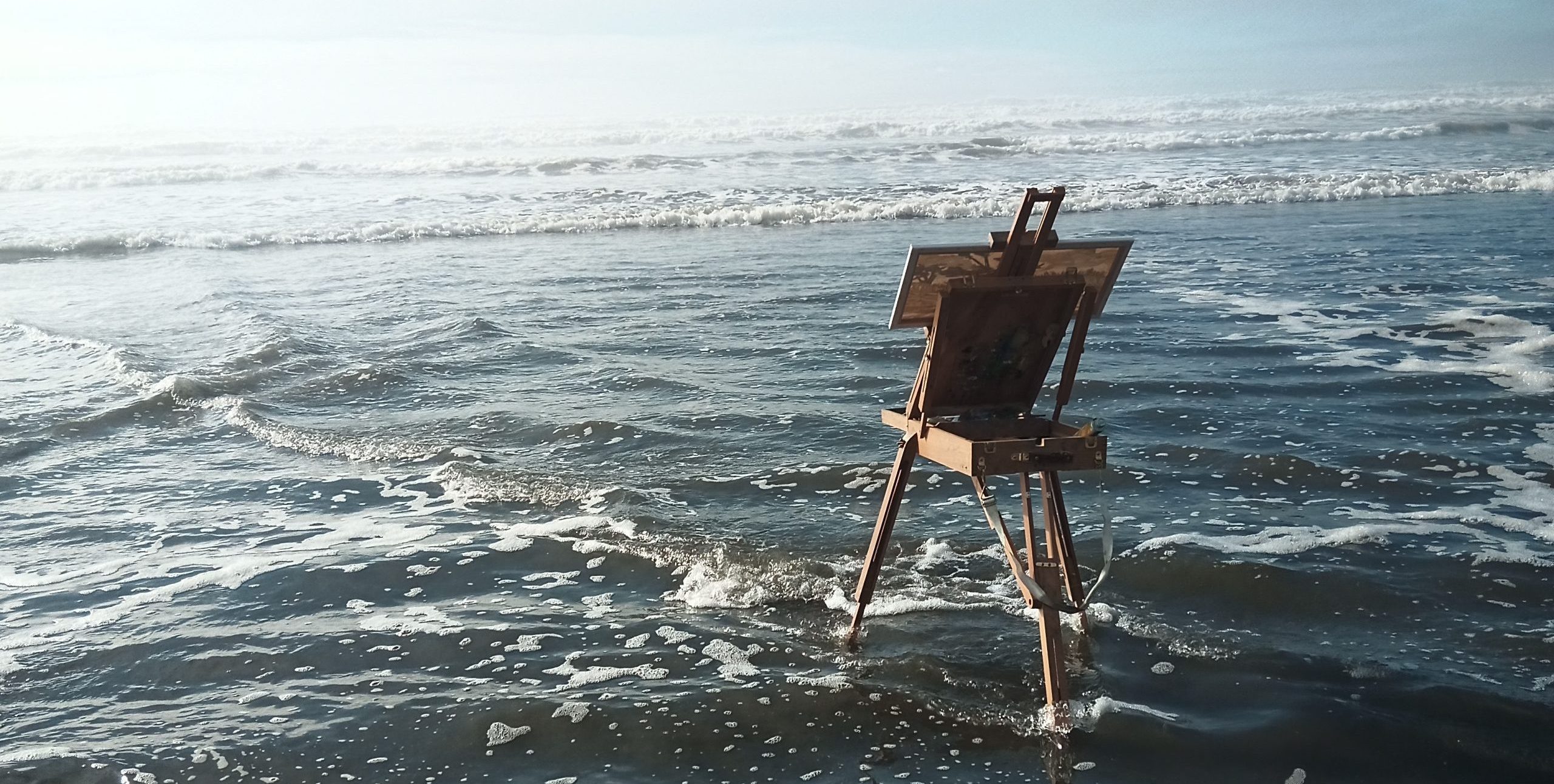 A scene of a french easel getting lots in waves.